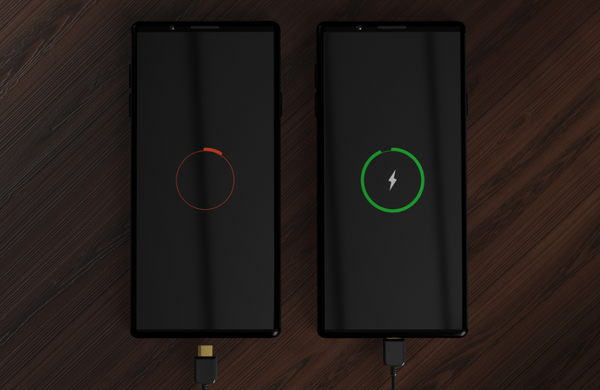 Two phones side by side, one is almost completely charged while the other is low battery. 